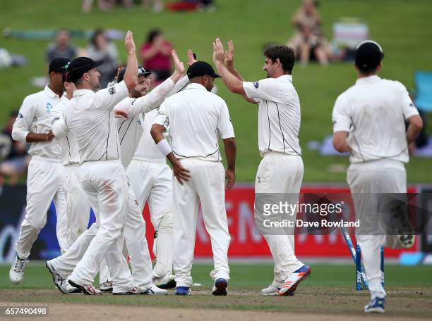 New Zealand celebrate the wicket of Hashim Amla of South Africa during day one of the Test match between New Zealand and South Africa at Seddon Park...