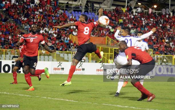 Trinidad and Tobago's Khaleem Hyland jumps for the ball during the 2018 FIFA World Cup qualifier football match against Panama in Port of Spain,...