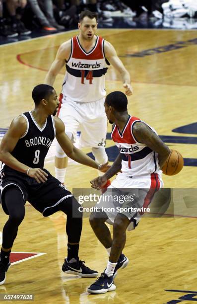 Washington Wizards guard Brandon Jennings makes a behind the back pass to Washington Wizards forward Jason Smith in the second half against Brooklyn...