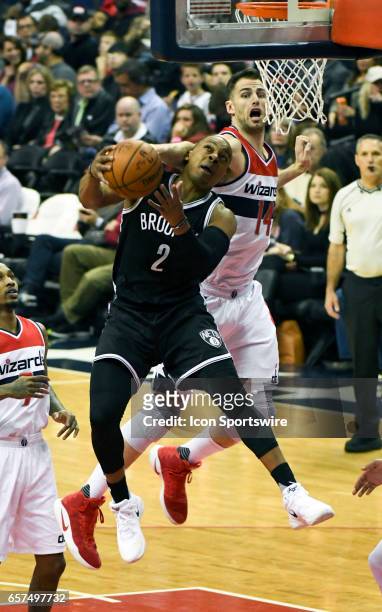 Brooklyn Nets guard Randy Foye is fouled by Washington Wizards forward Jason Smith in the first half on March 24 at the Verizon Center in Washington,...