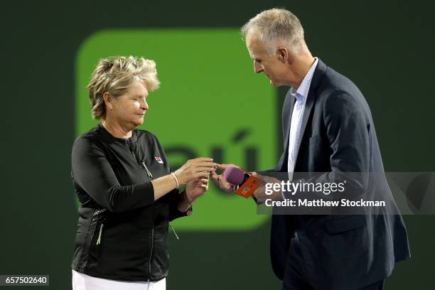 Hana Mandlikova receives a ring commemorating her induction into the International Tennis Hall of Fame from CEO Todd Martin during the Miami Open at...