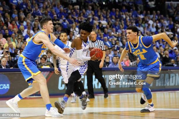 De'Aaron Fox of the Kentucky Wildcats drives against TJ Leaf and Lonzo Ball of the UCLA Bruins in the first half during the 2017 NCAA Men's...