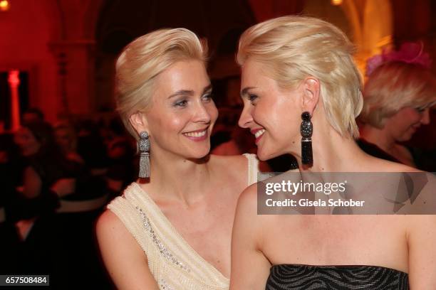 Julia Meise and her twin sister Nina Meise wearing jewelry by Thomas Jirgens, Juwelenschmiede, during the 8th Filmball Vienna at City Hall on March...