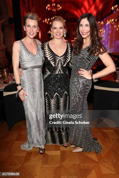 Alexandra Ries, Eva Krsak, fashion designer of Just Eve and Alexandra Polzin, wearing a dress by Just Eve during the 8th Filmball Vienna at City Hall...