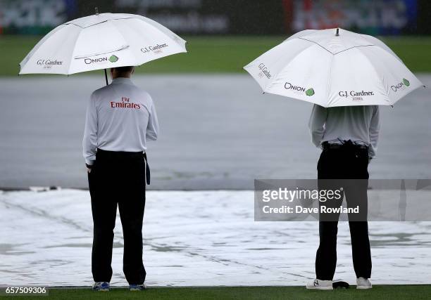 Umpires Rod Tucker and Bruce Oxenford inspect the pitch after a rain stoppage during day one of the Test match between New Zealand and South Africa...