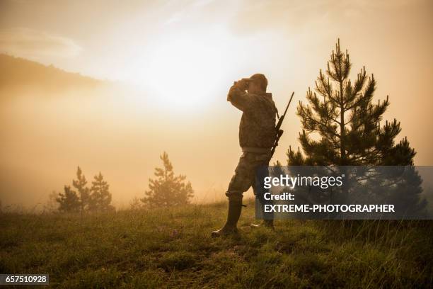 hunter in the nature - camo man stock pictures, royalty-free photos & images