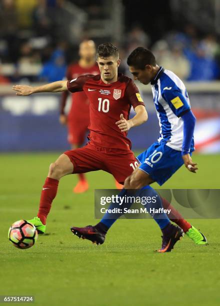 Christian Pulisic of the United States defends against Mario Martinez of Honduras during their FIFA 2018 World Cup Qualifier at Avaya Stadium on...