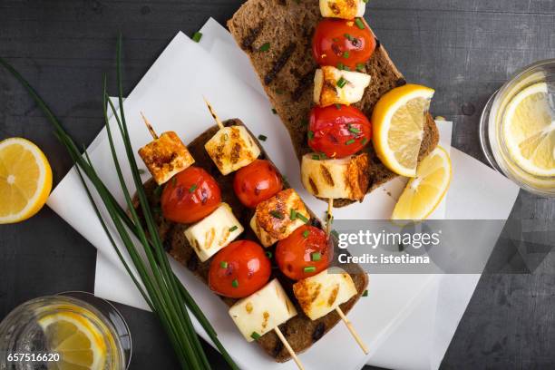 grilled haloumi skewer sandwich with tomato - grilled halloumi stock pictures, royalty-free photos & images