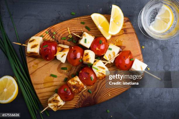 barbecue haloumi and cherry tomato skewers with lemon zest - grilled halloumi stock pictures, royalty-free photos & images