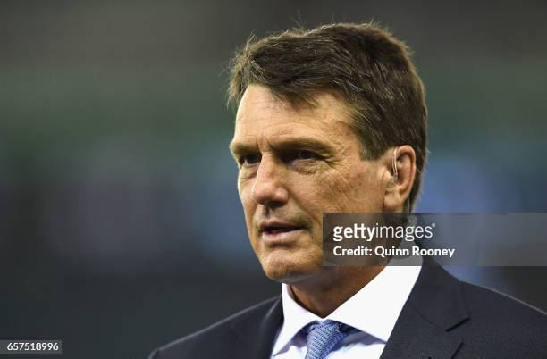 Paul Roos commentates on the sidelines during the round one AFL match between the St Kilda Saints and the Melbourne Demons at Etihad Stadium on March...