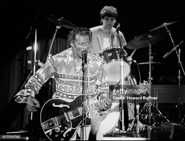 American Rock musician Chuck Berry plays guitar as he performs onstage, Cleveland, Ohio, March 21, 1986. The concert was held on the 34th anniversary...