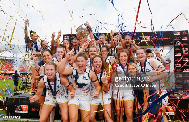 Crows players celebrate during the AFL Women's Grand Final between the Brisbane Lions and the Adelaide Crows on March 25, 2017 in Gold Coast,...