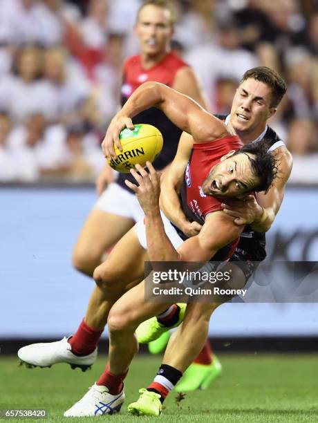 Jordan Lewis of the Demons is tackled by Jade Gresham of the Saints during the round one AFL match between the St Kilda Saints and the Melbourne...