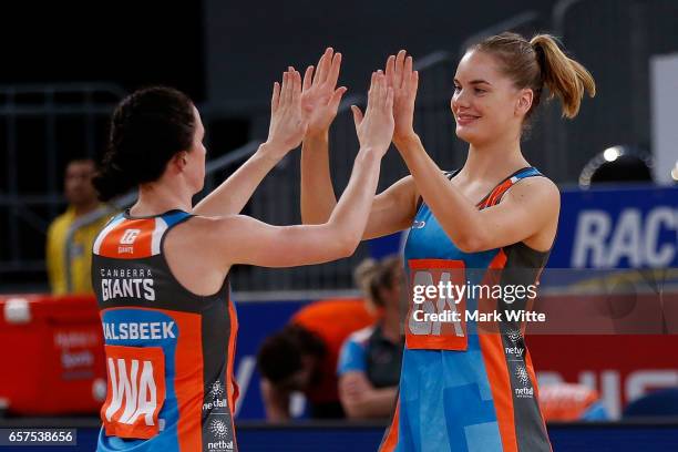 Leigh Kalsbeek and Keira Austin high five each other before the round six ANL match between the Vic Fury and the Canberra Giants at Hisense Arena on...