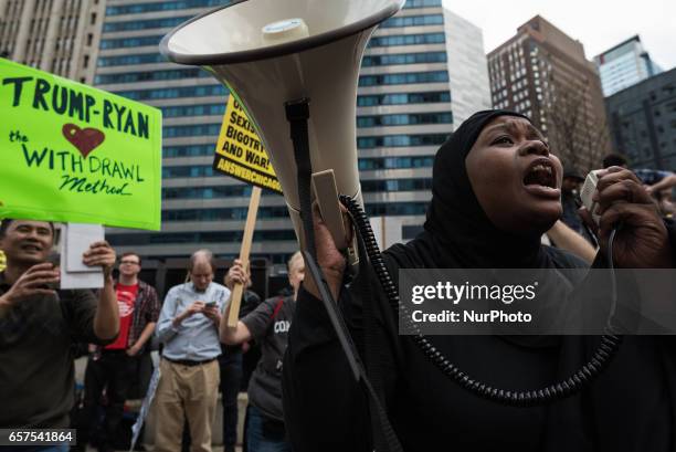 Demonstrators gather across from Trump International Hotel and Tower in Chicago to celebrate the Republican Partys failed repeal of the Affordable...