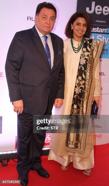 Indian Bollywood actor Rishi Kapoor and actress Neetu Singh pose as they attend the "HT Most Stylish" awards ceremony in Mumbai late March 24, 2017....