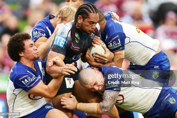 Martin Taupau of the Sea Eagles is tackled during the round four NRL match between the Manly Warringah Sea Eagles and the Canterbury Bulldogs at...