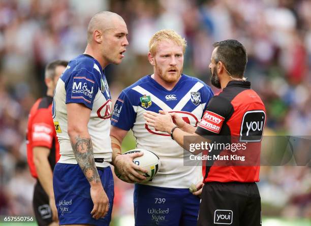 Referee Gavin Badger speaks to David Klemmer of the Bulldogs after he slapped Daly Cherry-Evans of the Sea Eagles on the face as captain James Graham...