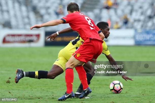 Kwabena Appiah of the Mariners is contested by the Adelaide defence during the round 24 A-League match between Central Coast Mariners and Adelaide...