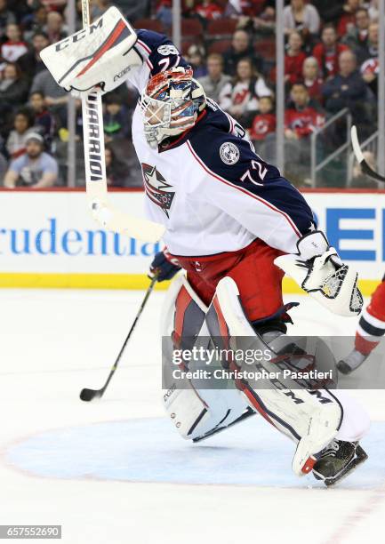 Sergei Bobrovsky of the Columbus Blue Jackets leaps in the air as he defends his et during the second period against the New Jersey Devils on March...