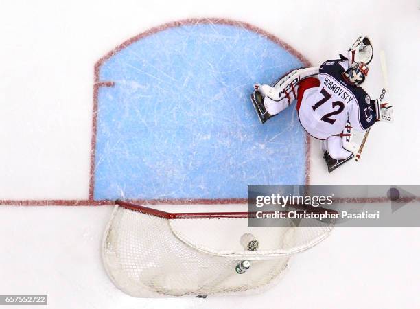 Sergei Bobrovsky of the Columbus Blue Jackets makes a glove save during the game against the New Jersey Devils on March 19, 2017 at the Prudential...