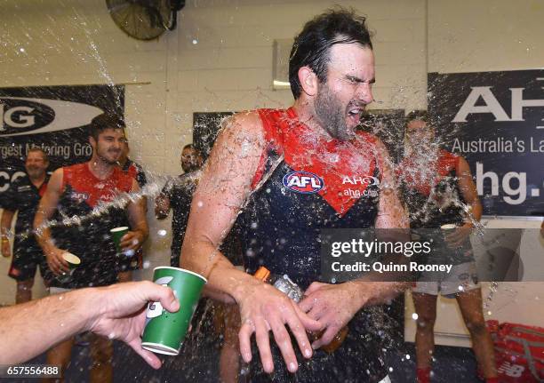 Jordan Lewis of the Demons is sprayed with drinks in the rooms after the Demons won the round one AFL match between the St Kilda Saints and the...