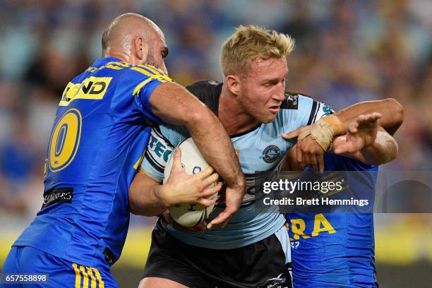 Matthew Prior of the Sharks is tackled during the round four NRL match between the Parramatta Eels and the Cronulla Sharks at ANZ Stadium on March...