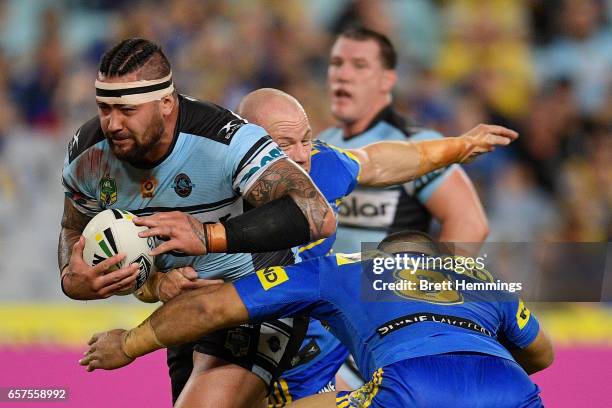 Andrew Fifita of the Sharks is tackled during the round four NRL match between the Parramatta Eels and the Cronulla Sharks at ANZ Stadium on March...