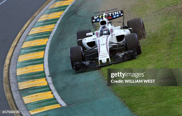 Williams' Canadian driver Lance Stroll speeds through the grass during the qualifying session for the Formula One Australian Grand Prix in Melbourne...