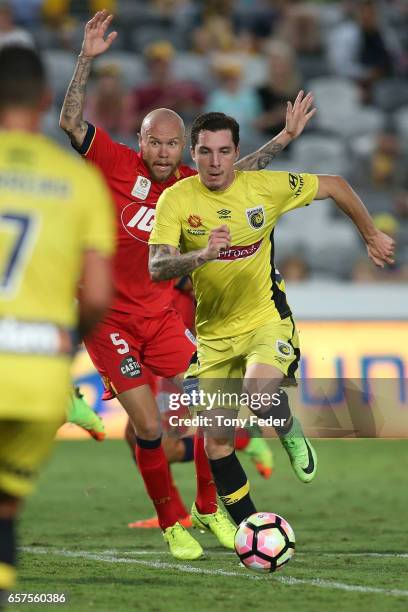 Storm Roux of the Mariners contests the ball with Taylor Regan of Adelaide during the round 24 A-League match between Central Coast Mariners and...