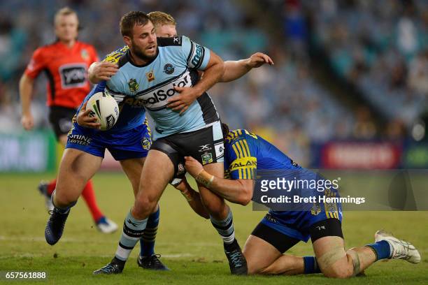 Wade Graham of the Sharks offloads the ball in a tackle during the round four NRL match between the Parramatta Eels and the Cronulla Sharks at ANZ...