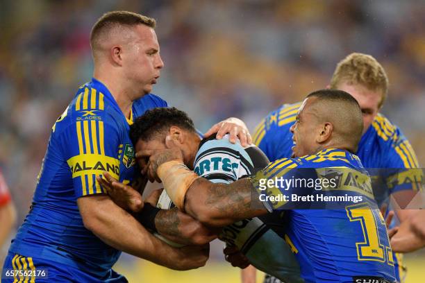 Ricky Leutele of the Sharks is tackled during the round four NRL match between the Parramatta Eels and the Cronulla Sharks at ANZ Stadium on March...