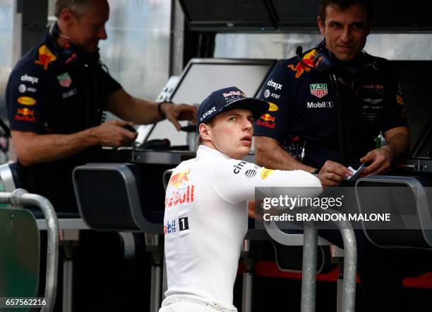 Red Bull's Dutch driver Max Verstappen stands in pit lane before the start of the qualifying session for the Formula One Australian Grand Prix in...