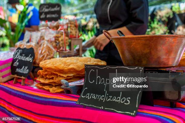 sweet caramel edible mexican chapulines (grasshoppers) - mexico market stock pictures, royalty-free photos & images