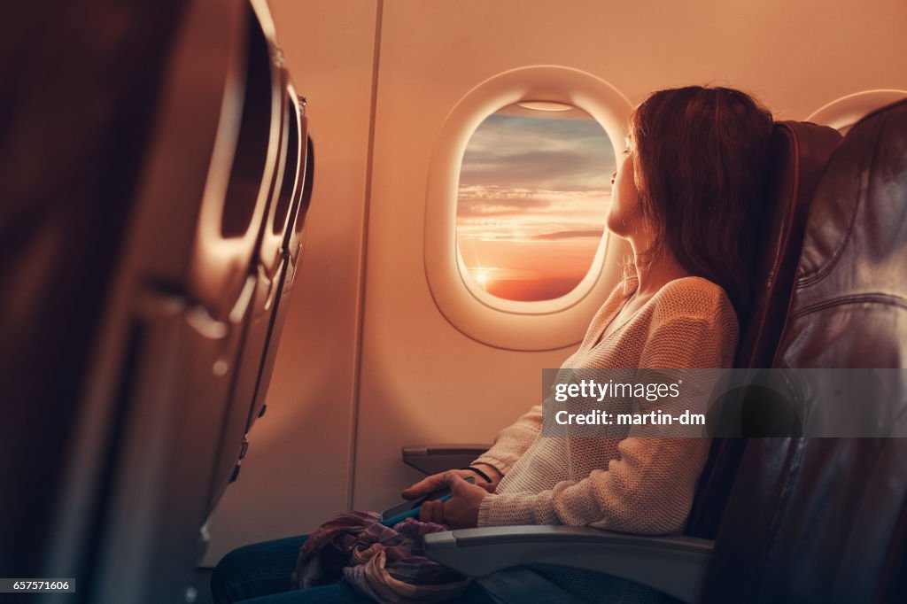 Young woman flying to France