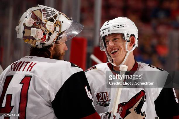 Connor Murphy of the Arizona Coyotes chats with teammate Goaltender Mike Smith during a break in the action against the Florida Panthers at the BB&T...