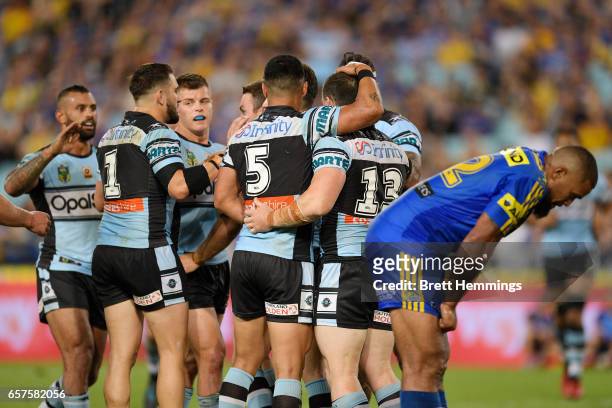 James Maloney of the Sharks celebrates scoring a try with team mates during the round four NRL match between the Parramatta Eels and the Cronulla...