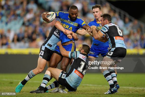 Semi Radrada of the Eels is tackled during the round four NRL match between the Parramatta Eels and the Cronulla Sharks at ANZ Stadium on March 25,...