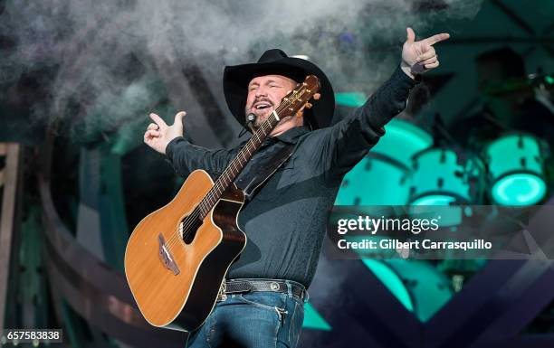 Singer-songwriter Garth Brooks performs during The Garth Brooks World Tour with Trisha Yearwood at Wells Fargo Center on March 24, 2017 in...