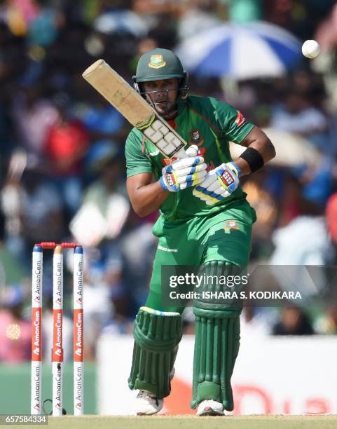 Bangladesh cricketer Sabbir Rahman watches the ball after playing a shot during the first one day international cricket match between Sri Lanka and...