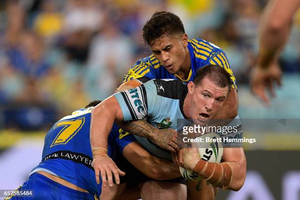 Paul Gallen of the Sharks is tackled during the round four NRL match between the Parramatta Eels and the Cronulla Sharks at ANZ Stadium on March 25,...