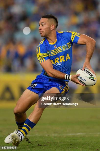 Corey Norman of the Eels passes the ball during the round four NRL match between the Parramatta Eels and the Cronulla Sharks at ANZ Stadium on March...