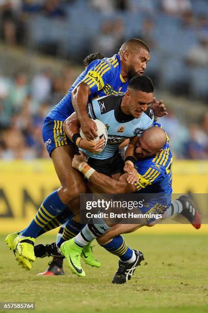 Valentine Holmes of the Sharks is tackled during the round four NRL match between the Parramatta Eels and the Cronulla Sharks at ANZ Stadium on March...