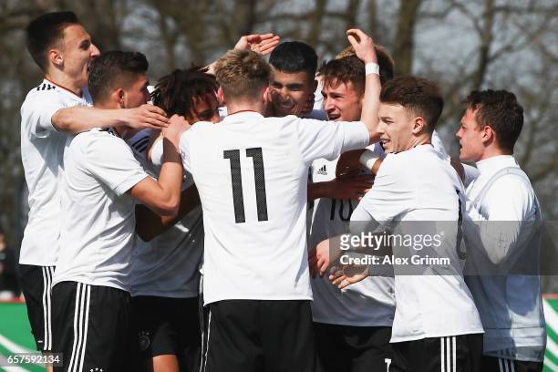 Aymen Barkok of Germany celebrates his team's first goal with team mates during the UEFA Elite Round match between U19 Germany and U19 Serbia at...