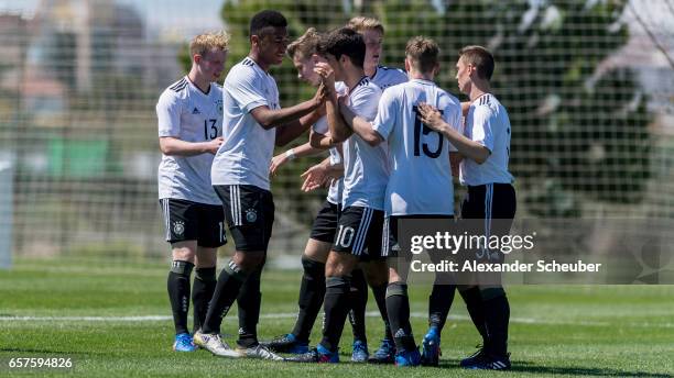 Elias Abouchabaka of Germany and Kilian Ludewig of Germany celebrate a goal during the UEFA U17 elite round match between Germany and Finland on...