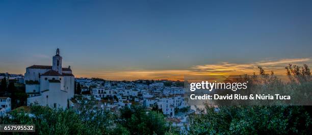 view of cadaqués at sunset - silueta stockfoto's en -beelden