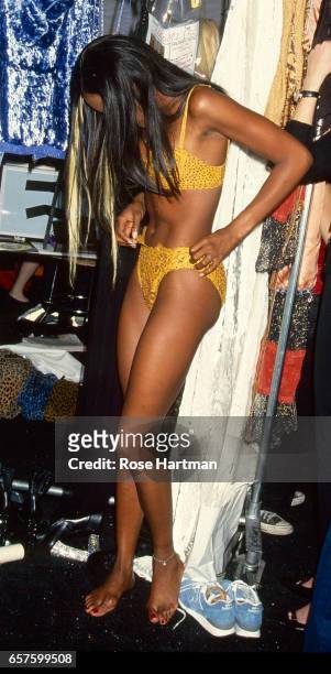 View of British model Naomi Campbell, in her underwear, as she dresses backstage at during a Betsey Johnson fashion show in Bryant Park, New York,...