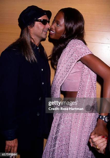 American photographer Steven Meisel talks British model Naomi Campbell at the Louis Vuitton store opening in the Soho neighborhood, New York, New...