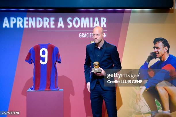 Son of late Dutch football star Johan Cruyff, Jordi Cruyff poses with the "Ballon d'Or" won by his father in 1974, on the first anniversary of Johan...