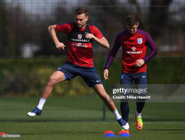 Ben Gibson of England runs through drills with teammates during the England training session at the Tottenham Hotspur Training Centre on March 25,...